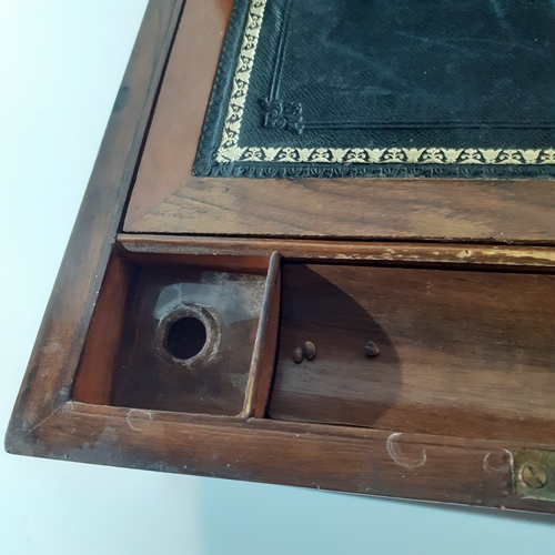 26 - Antique wooden writing slope with inkwell and internal compartments. Brass decorated corners. No key... 