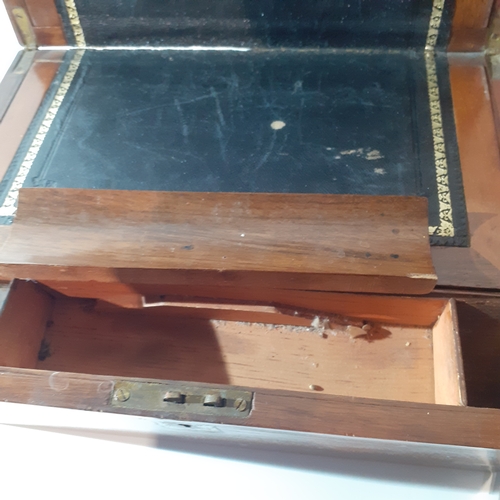 26 - Antique wooden writing slope with inkwell and internal compartments. Brass decorated corners. No key... 