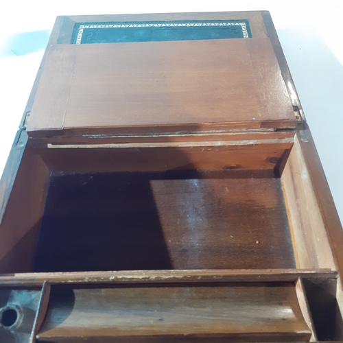 26 - Antique wooden writing slope with inkwell and internal compartments. Brass decorated corners. No key... 