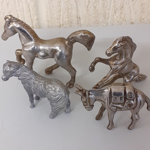 1 - Small metal horse figurines quite heavy and solid.