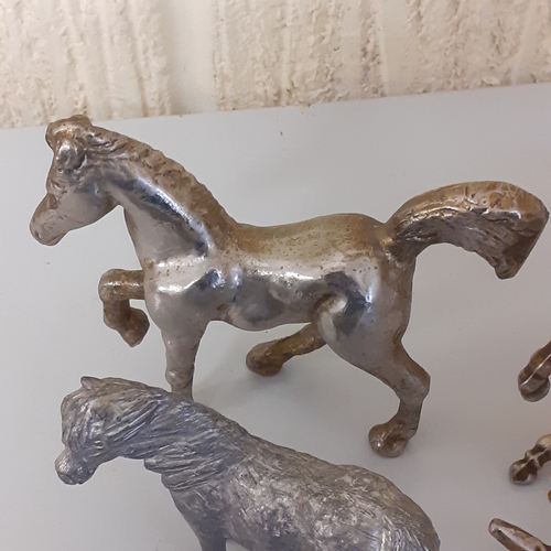 1 - Small metal horse figurines quite heavy and solid.