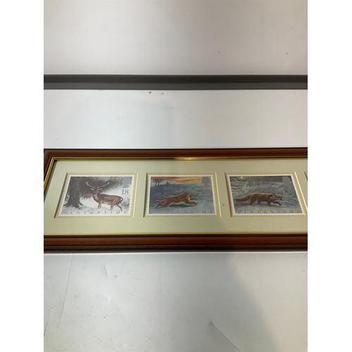 156 - Framed and glazed landscape large postage stamps depicting winter scenes  in nominations 18,24, 28,3... 