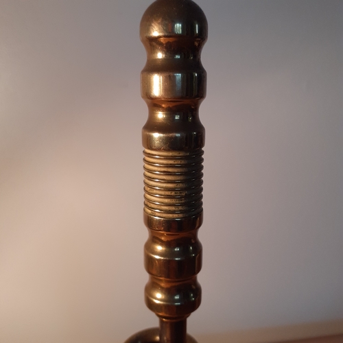 4 - Brass poker in holder. Approx 27cm