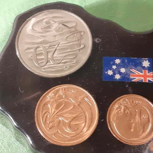 17 - Australian coin set in casing. Looks like pen or something missing from stand