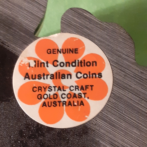 17 - Australian coin set in casing. Looks like pen or something missing from stand