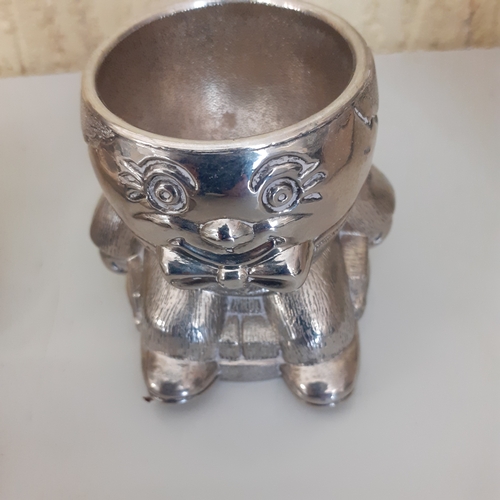 28 - Small collection of silver plate and metal christening items. Teddy money box, Humpty Dumpty picture... 