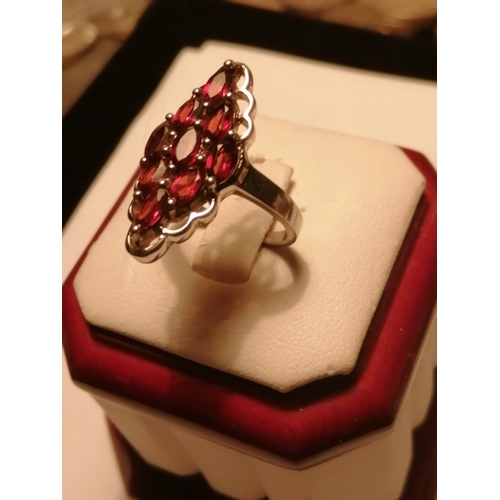 28A - Silver ring set with 9 red gemstones 5.0 grams Size O