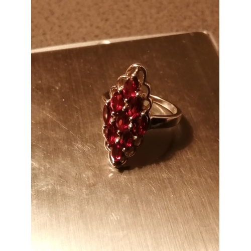 28A - Silver ring set with 9 red gemstones 5.0 grams Size O