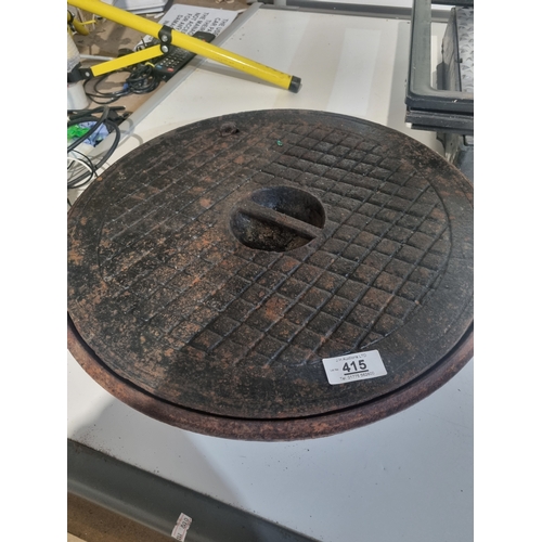 415 - Large cast iron inspection cover and base approx 52cm round