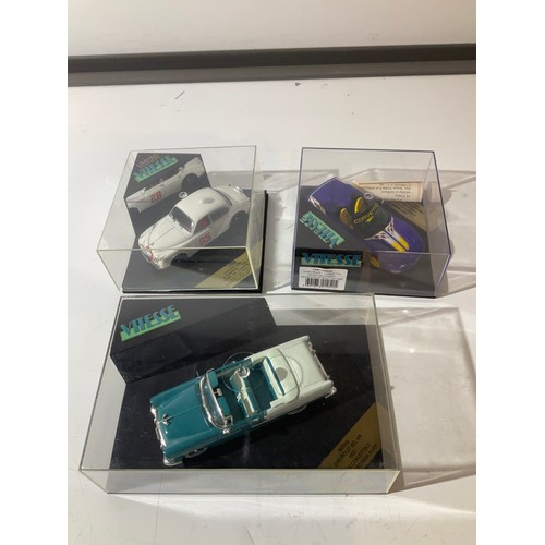 54 - Limited edition vitesse model cars in display cases corvette jaguar and chevy bel air