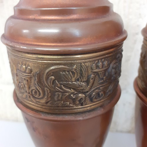 4 - Pair of copper vases with detailed brass inlay.