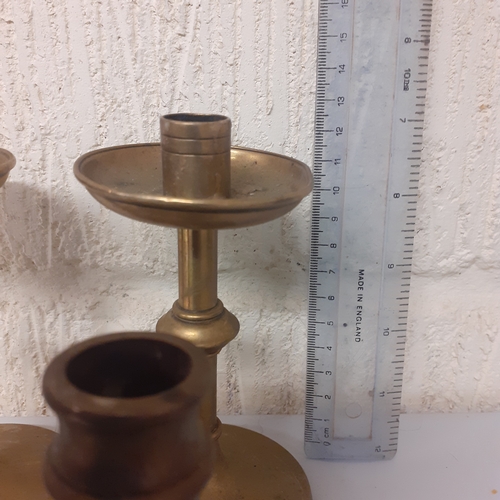 7 - 4 brass candlesticks, 2 matching pairs.