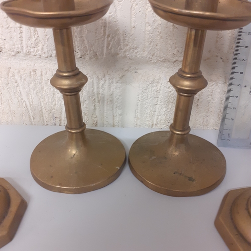 7 - 4 brass candlesticks, 2 matching pairs.