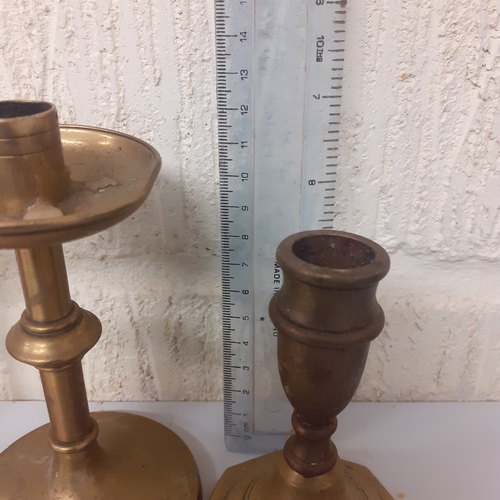 7 - 4 brass candlesticks, 2 matching pairs.