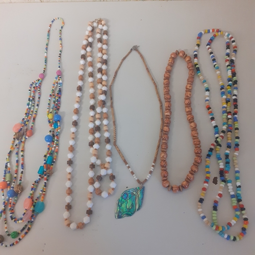 9 - Selection of colourful beaded necklaces in good condition.