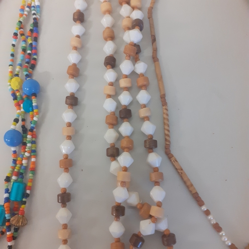 9 - Selection of colourful beaded necklaces in good condition.