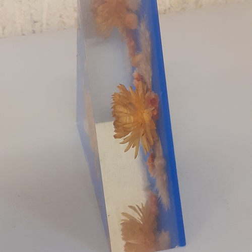 121 - Resin dried flower paperweight. Pyramid shape.