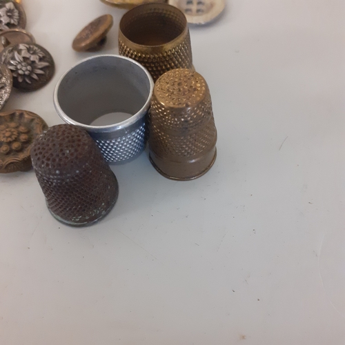 85 - Quantity of various metal buttons and thimbles. Including AFS