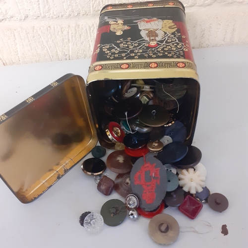 20 - Vintage tea tin with a quantity of mostly single buttons including leather football style, metal and... 