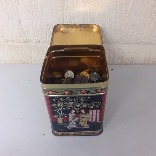 20 - Vintage tea tin with a quantity of mostly single buttons including leather football style, metal and... 