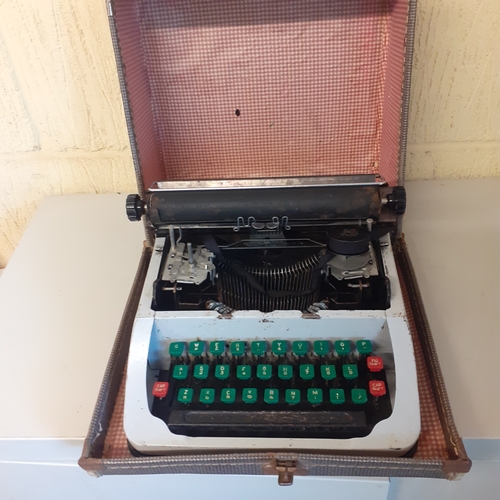 21 - Childs size vintage typewriter. No makers mark, possibly Lilliput. Circa 1950s. Needs cleaning upand... 