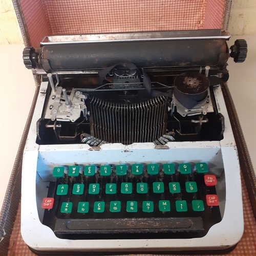 21 - Childs size vintage typewriter. No makers mark, possibly Lilliput. Circa 1950s. Needs cleaning upand... 