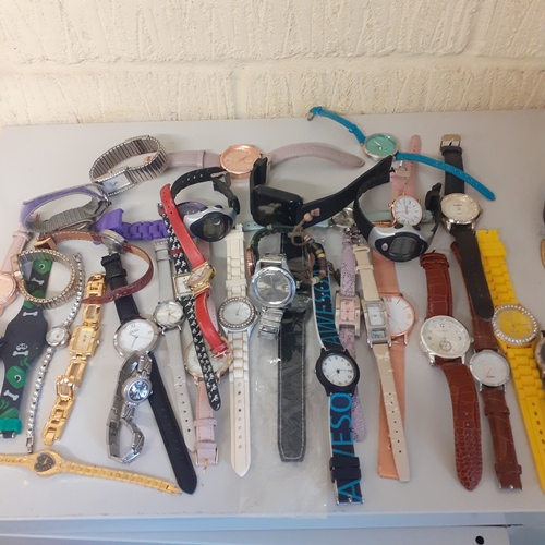 23 - Large quantity of watches. Most working but need batteries. A few spares or repairs including a Lotu... 