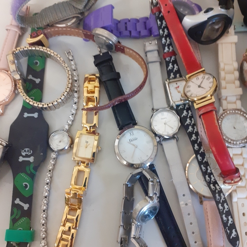 23 - Large quantity of watches. Most working but need batteries. A few spares or repairs including a Lotu... 