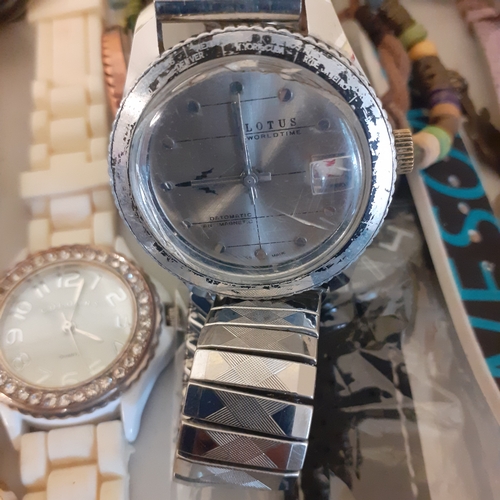 23 - Large quantity of watches. Most working but need batteries. A few spares or repairs including a Lotu... 