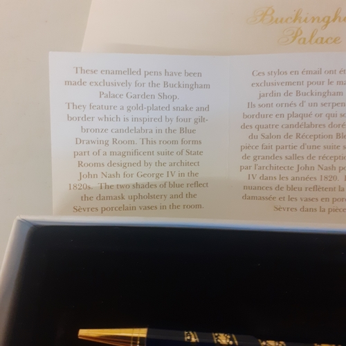 24 - Buckingham Palace souviner pen. Gold plated snake design. With certificate and box.