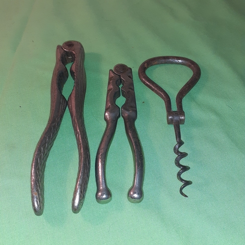 29 - Old vintage corkscrew and 2 nutcracker.