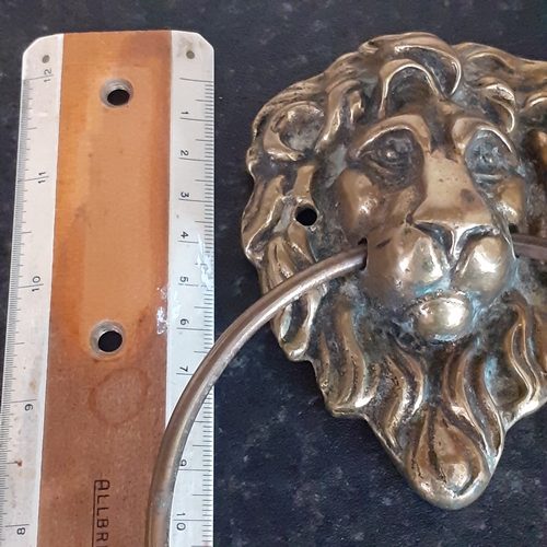 143 - Vintage, possibly antique brass lions head door pull. Nice detail. Large pull ring