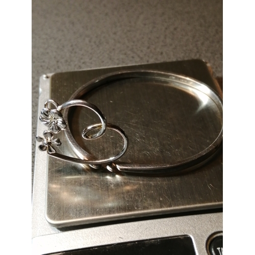 29A - Silver bangle with heart shaped floral design 11.16 grams