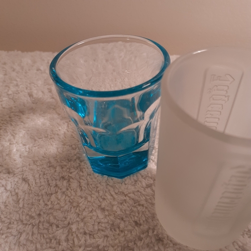 4 nice shot glasses. 2 Jägermeister and one pink, one blue.