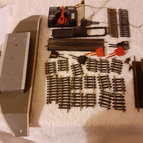 151 - Quantity of small Horby track, a battery controller, triang platform and spare platform piece. Dubli... 