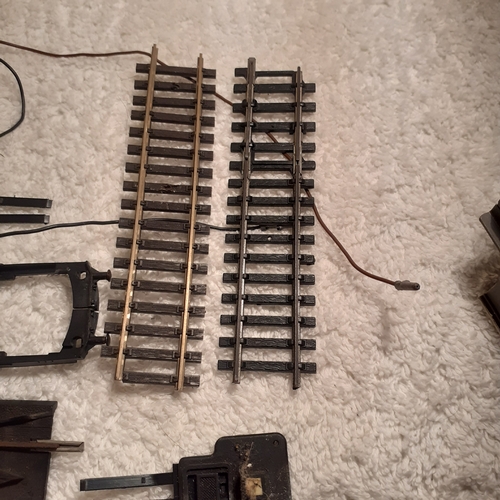 151 - Quantity of small Horby track, a battery controller, triang platform and spare platform piece. Dubli... 