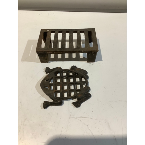 16 - Cast iron trivets x 2 - one in the shape of a frog