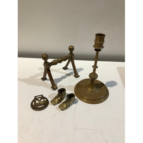 18 - Quantity of brass items inc brass boots & candlestick. One fire dog and a horse brass