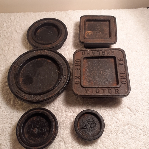 66 - Cast iron stacking weights, various. Mostly branded Victor.