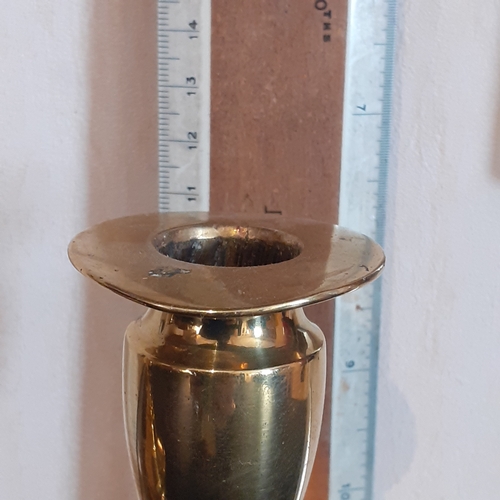 76 - Pair oval shape base brass candlesticks. Just short of 11cm.