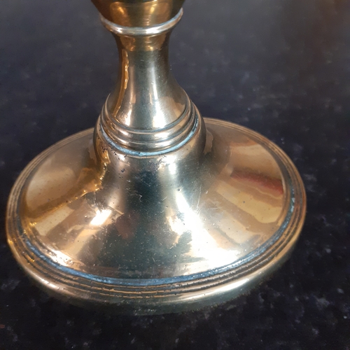 76 - Pair oval shape base brass candlesticks. Just short of 11cm.