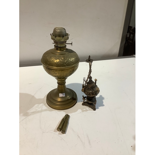 90 - Brassware oil lamp, another candle burner & brass spent Cartridges