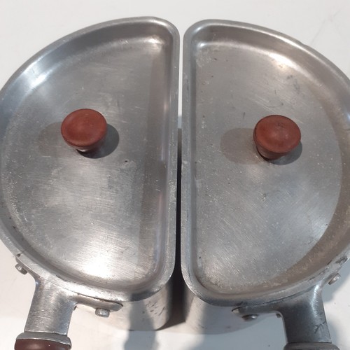 108 - 2 stainless Steel Swan half pans, very good condition. Look like bakelite handles and knobs.