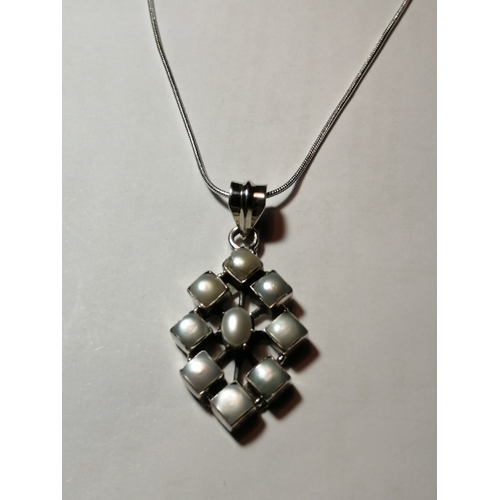 29A - Silver necklace with diamond shaped pendant set with 9 white gemstones 12.46 grams