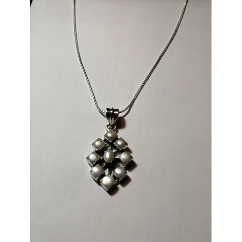 29A - Silver necklace with diamond shaped pendant set with 9 white gemstones 12.46 grams