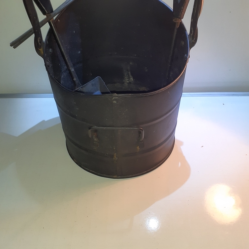 5 - Black metal coal scuttle with a brush and shovel.