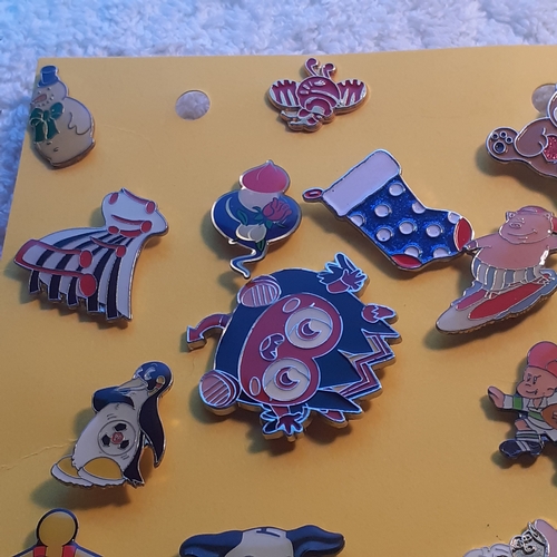 8 - Quantity of metal enamelled pin badges. Cartoon characters,  animals and charity's included.