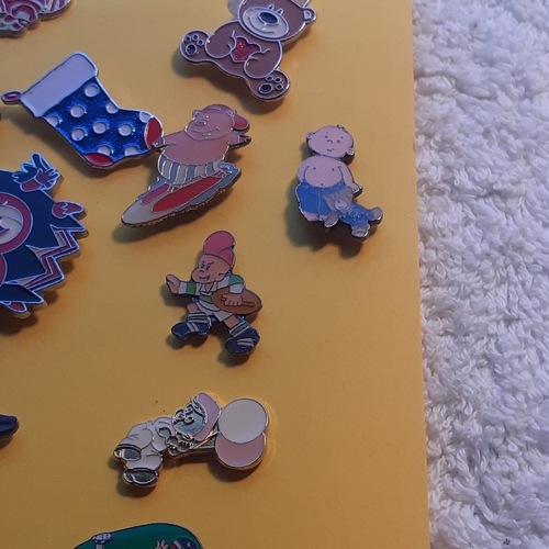 8 - Quantity of metal enamelled pin badges. Cartoon characters,  animals and charity's included.