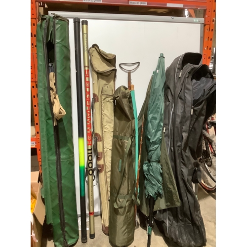 356 - Large lot of fishing rods, bags & umbrellas