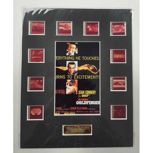 89A - 2 mounted original film cells with pictures and metal plaques. “Goldfinger” 25cm x 20 cm. “Tomorrow ... 